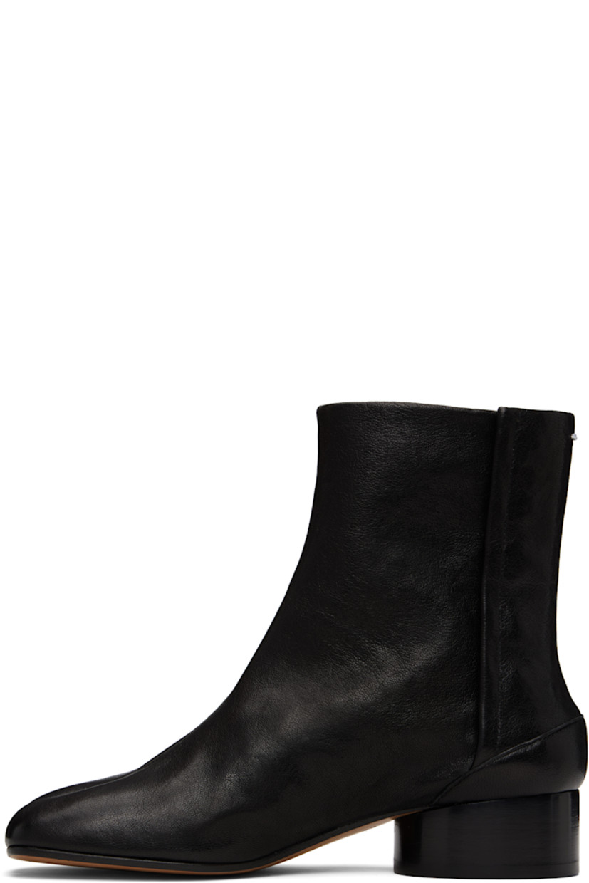 Ankle-high buffed lambskin boots.

· Square cleft toe
· Hook-eye closure at inner side
· White stitching at heel collar
· Stacked cylindrical heel with rubber injection
· Calfskin sole
· Heel: H1.25"

Supplier color: Black