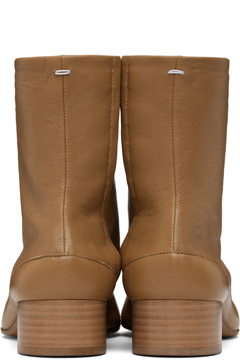 Ankle-high buffed lambskin boots.

· Square cleft toe
· Hook-eye closure at inner side
· White stitching at heel collar
· Stacked cylindrical heel with rubber injection
· Calfskin sole
· Heel: H1.25"

Supplier color: Nude