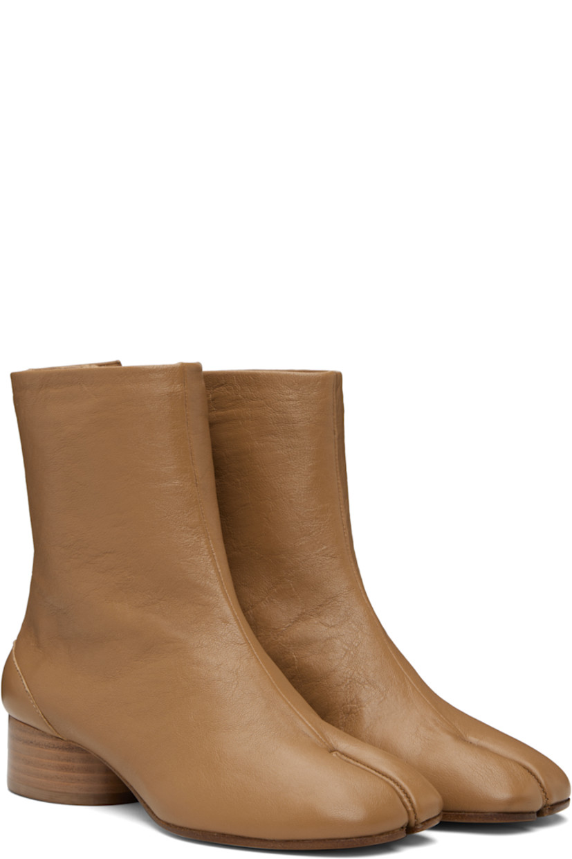 Ankle-high buffed lambskin boots.

· Square cleft toe
· Hook-eye closure at inner side
· White stitching at heel collar
· Stacked cylindrical heel with rubber injection
· Calfskin sole
· Heel: H1.25"

Supplier color: Nude