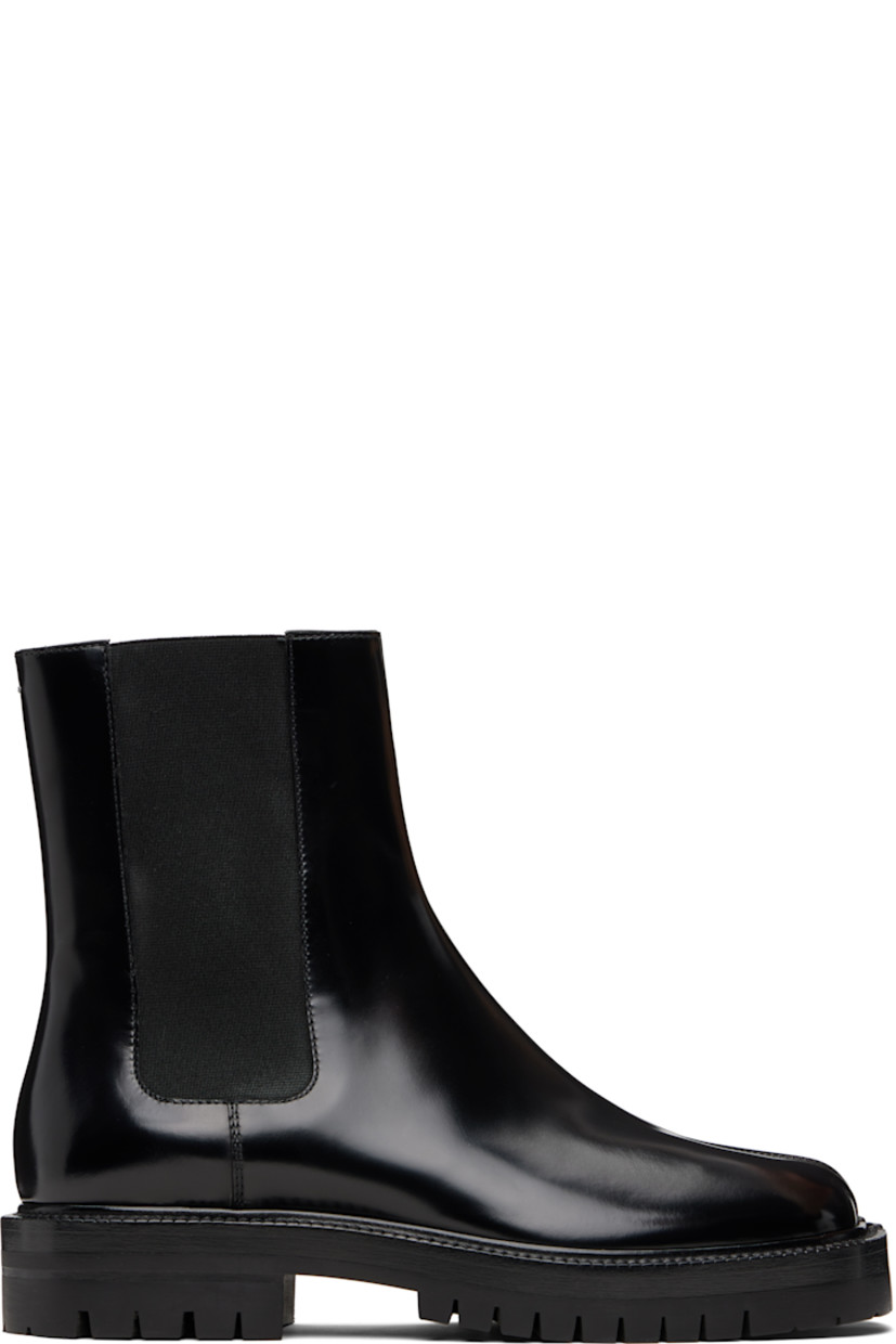 Ankle-high polished calfskin Chelsea boots.

· Square cleft toe
· Elasticized gusset at sides
· Signature white stitch at heel collar
· Buffed lambskin lining
· Stacked leather heel and midsole
· Lugged rubber sole
· Heel: H1.25"

Supplier color: Black