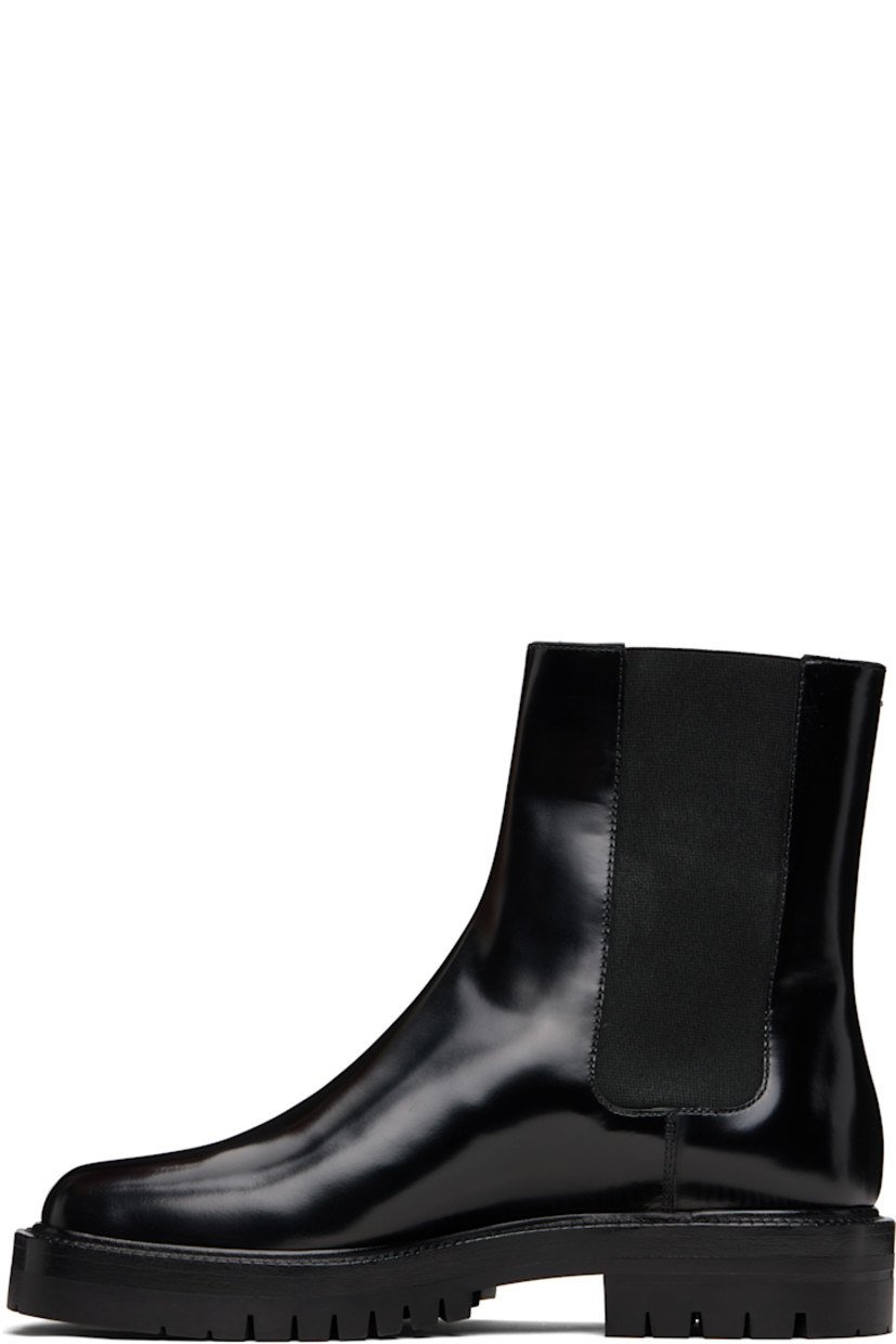 Ankle-high polished calfskin Chelsea boots.

· Square cleft toe
· Elasticized gusset at sides
· Signature white stitch at heel collar
· Buffed lambskin lining
· Stacked leather heel and midsole
· Lugged rubber sole
· Heel: H1.25"

Supplier color: Black