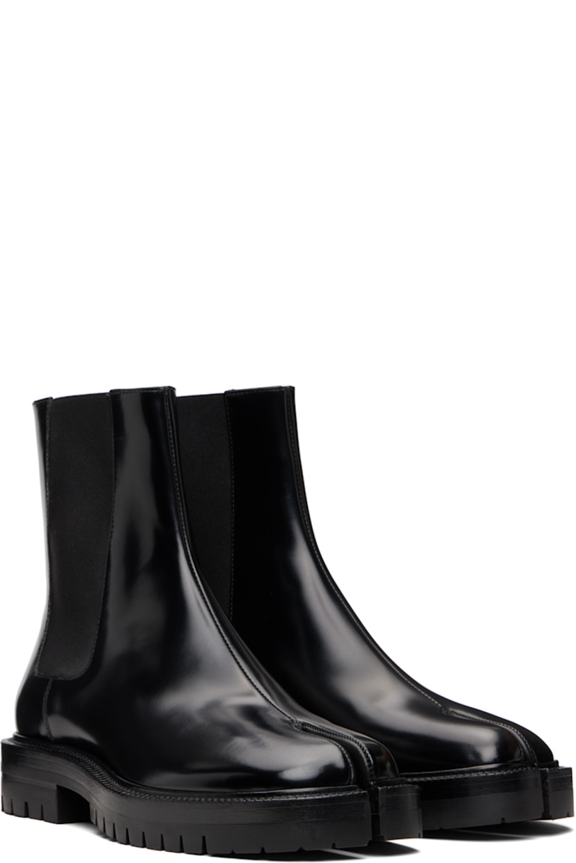 Ankle-high polished calfskin Chelsea boots.

· Square cleft toe
· Elasticized gusset at sides
· Signature white stitch at heel collar
· Buffed lambskin lining
· Stacked leather heel and midsole
· Lugged rubber sole
· Heel: H1.25"

Supplier color: Black