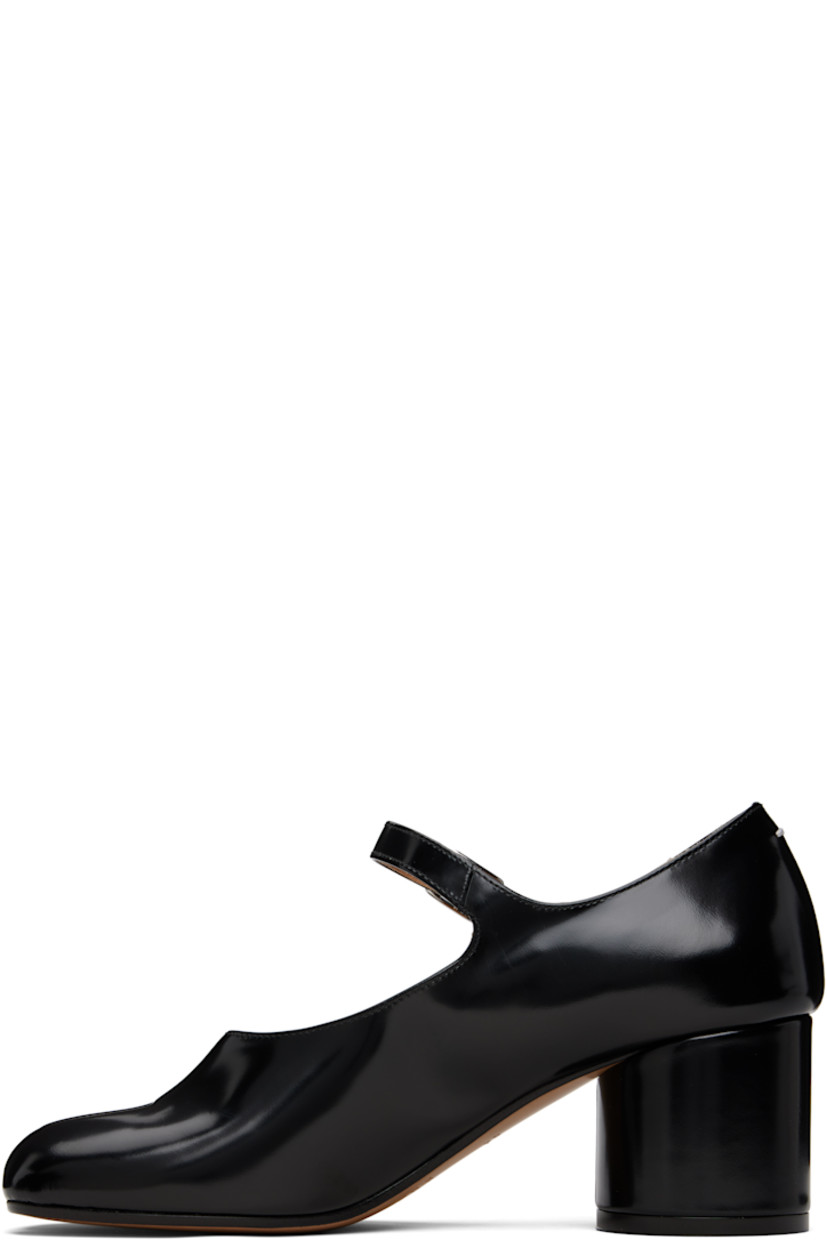 Polished calfskin Mary Jane-style heels.

· Square cleft toe
· Pin-buckle strap at vamp
· White stitching at heel collar
· Buffed lambskin lining
· Covered block heel with rubber injection
· Calfskin sole
· Heel: H2.25"

Supplier color: Black