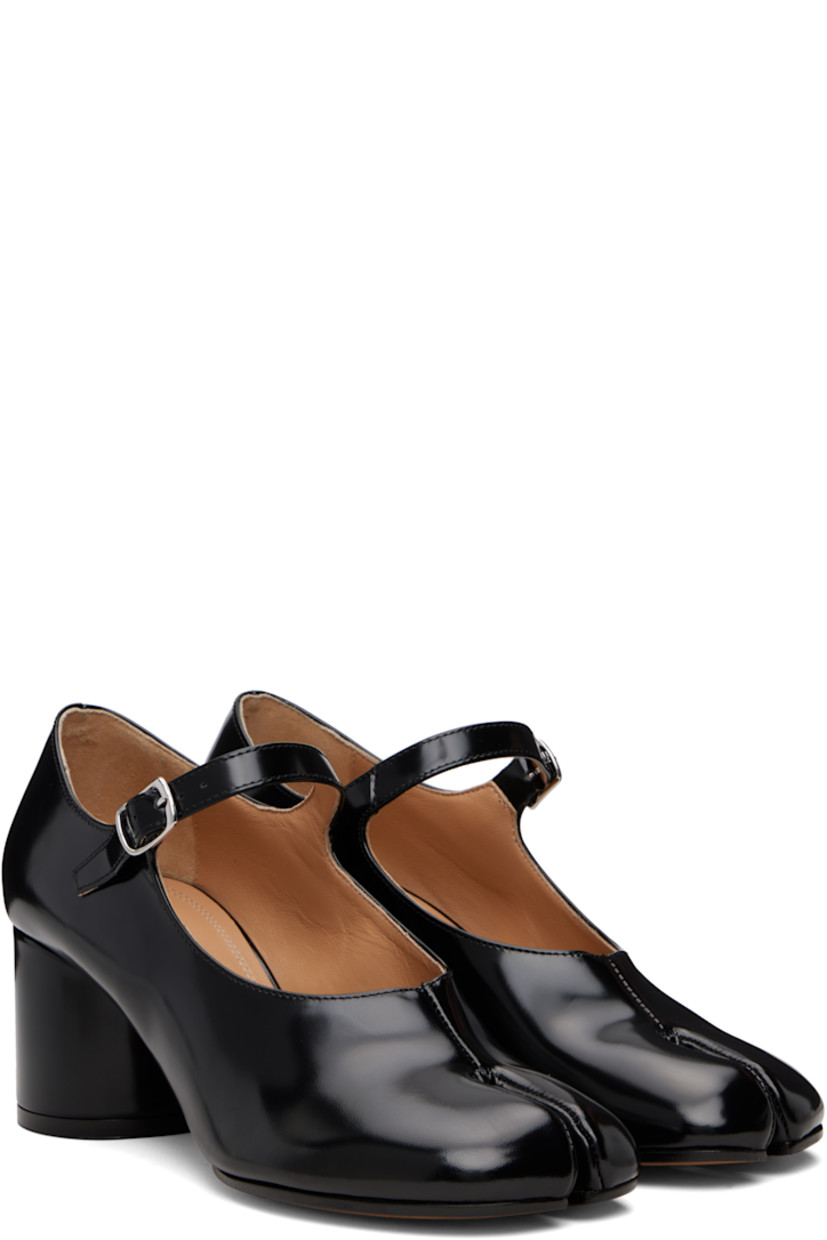 Polished calfskin Mary Jane-style heels.

· Square cleft toe
· Pin-buckle strap at vamp
· White stitching at heel collar
· Buffed lambskin lining
· Covered block heel with rubber injection
· Calfskin sole
· Heel: H2.25"

Supplier color: Black