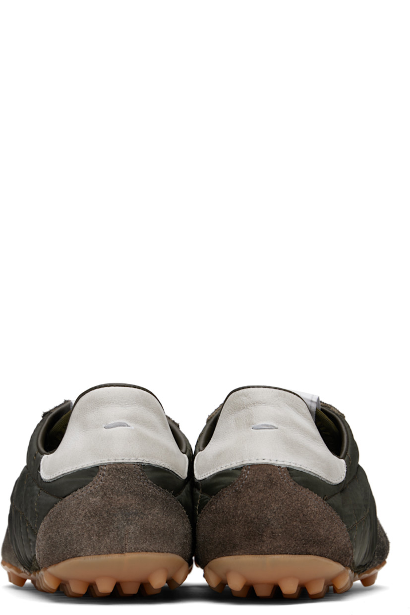 Low-top quilted taffeta and calfskin suede sneakers.

· Lace-up closure
· Logo patch at tongue
· White stitching at heel tab
· Twill lining
· Treaded rubber sole
 
Supplier color: Dark green/White