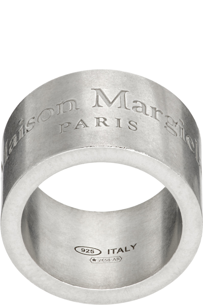 Band ring in antiqued sterling silver.

· Logo engraved at face
· Hallmarking at inner band

Supplier color: Palladio buratta
