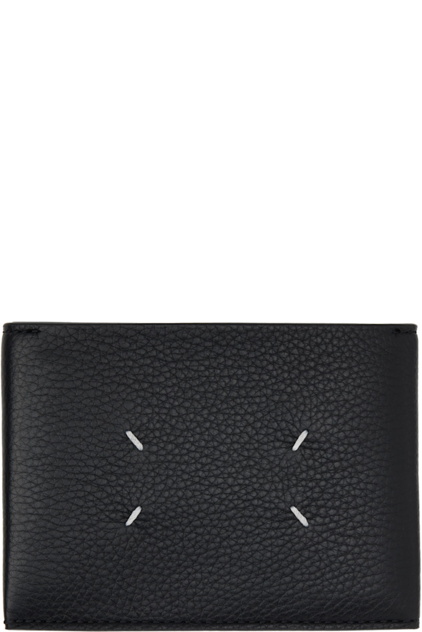 Grained calfskin bifold wallet.

· White stitching at face and back face
· Logo printed at face
· Two patch pockets
· Six card slots
· H3.5" x W4.75" x D1"

Supplier color: Black/Black/Black