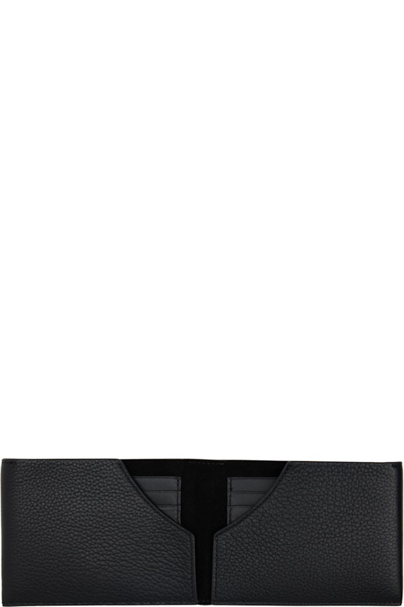 Grained calfskin bifold wallet.

· White stitching at face and back face
· Logo printed at face
· Two patch pockets
· Six card slots
· H3.5" x W4.75" x D1"

Supplier color: Black/Black/Black