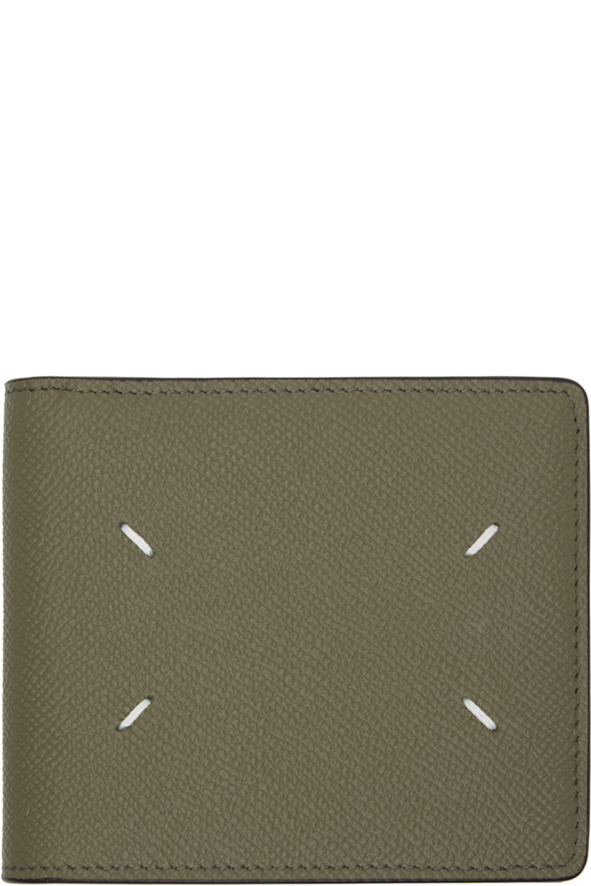 Pebble-grained calfskin bifold wallet.

· White stitching at face 
· Eight card slots and two patch pockets at interior 
· Two note slots 
· Canvas lining 
· H3.75" x W4.25" x D0.75"

Supplier color: Khaki