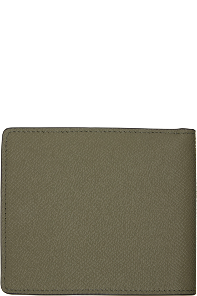 Pebble-grained calfskin bifold wallet.

· White stitching at face 
· Eight card slots and two patch pockets at interior 
· Two note slots 
· Canvas lining 
· H3.75" x W4.25" x D0.75"

Supplier color: Khaki