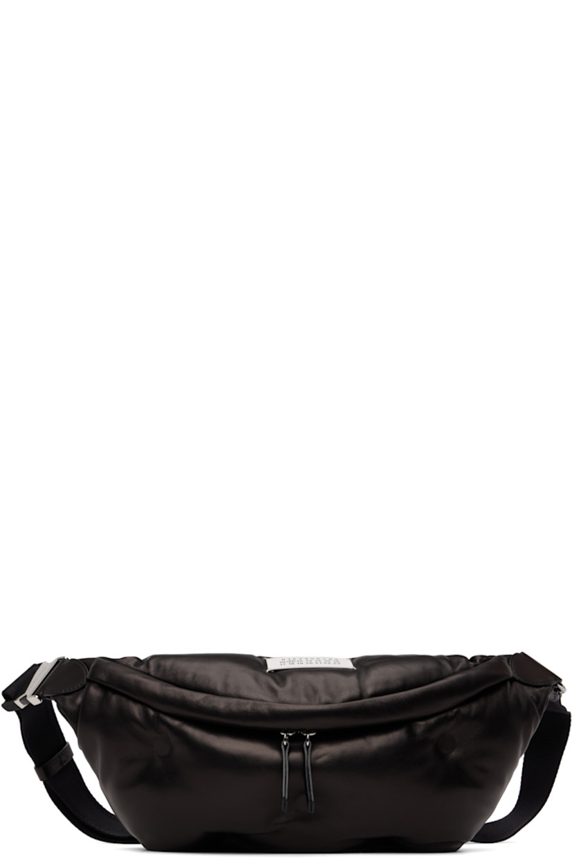 Grained sheepskin belt bag. 

· Adjustable crossbody strap with buckle
· Logo patch and white stitching at top
· Tufting at face
· Zip compartment at back face
· Zip closure at main compartment
· Zip pocket at interior
· Satin lining
· H7" x W16" x D4.5"

Supplier color: Black