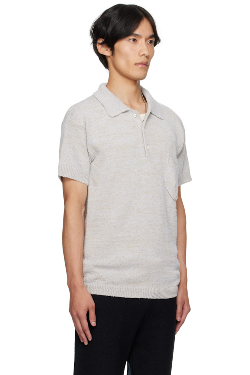 Knit cotton- and wool-blend polo.

· Subtle pilling throughout
· Rib-knit spread collar, hem, and cuffs
· Three-button placket
· Patch pocket at chest
· White stitching at back collar

Supplier color: Ice blue/Beige