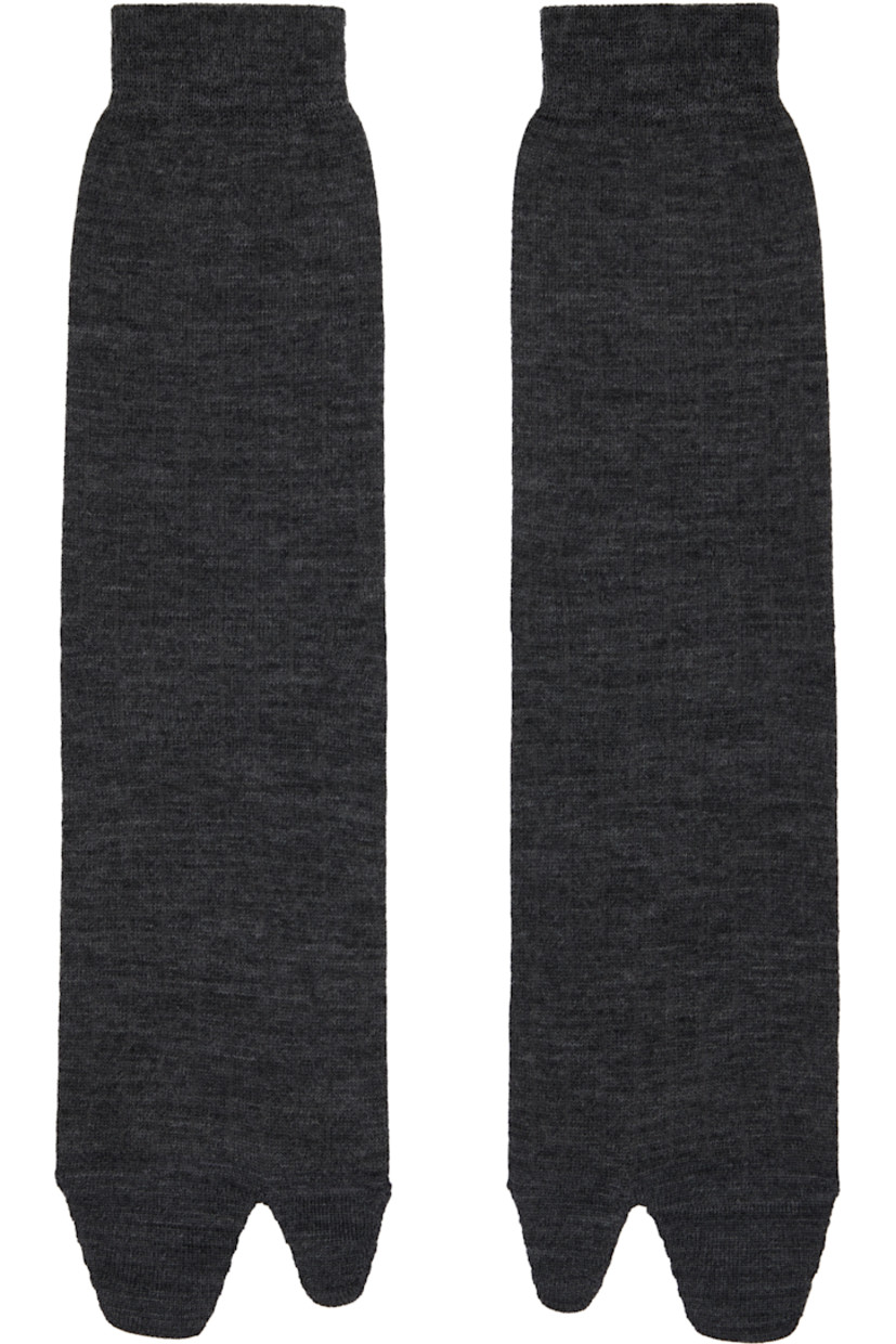 Calf-high wool-blend jersey socks.

· Signature white stitching at rib knit cuff
· Cleft toe

Supplier color: Dark grey