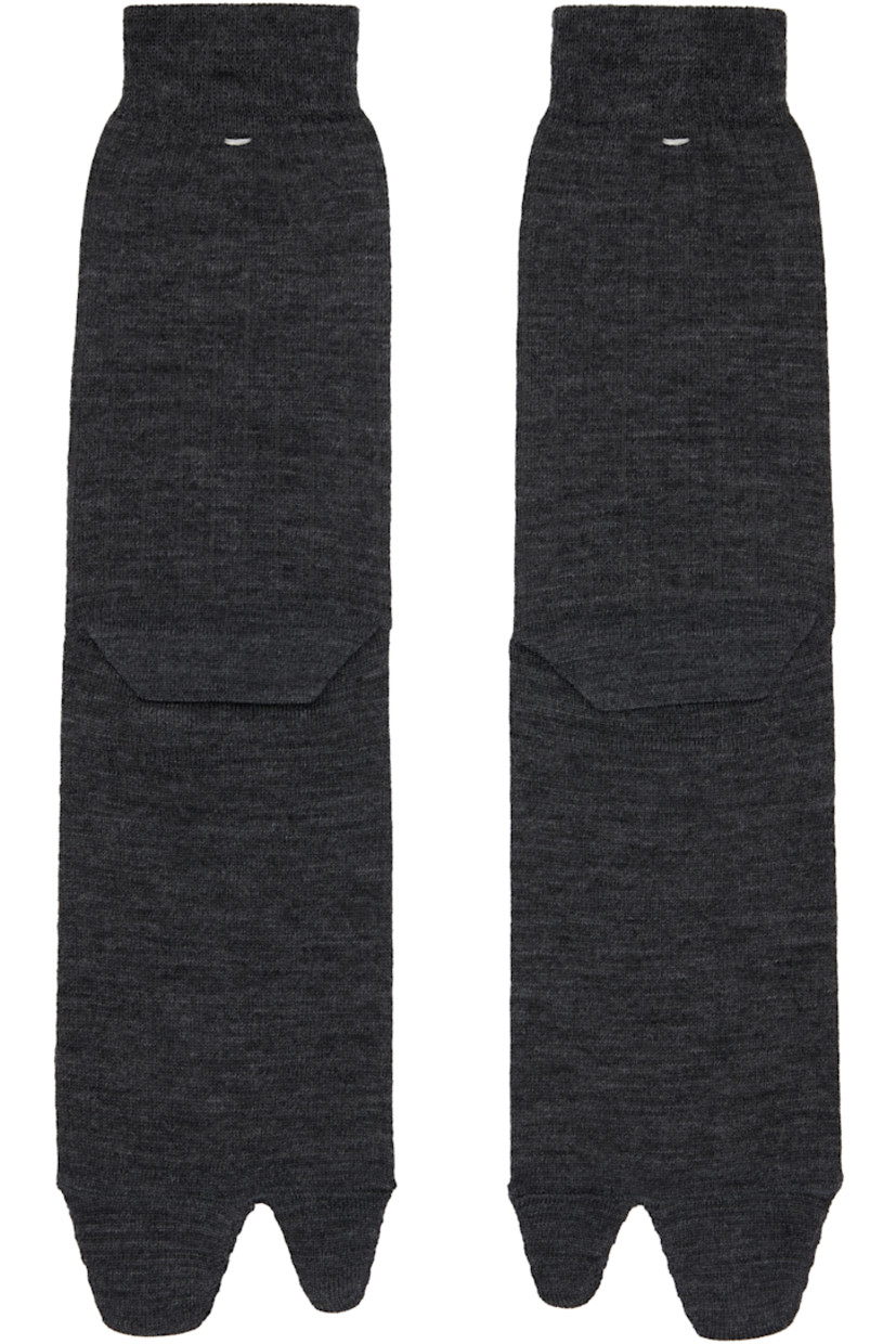 Calf-high wool-blend jersey socks.

· Signature white stitching at rib knit cuff
· Cleft toe

Supplier color: Dark grey