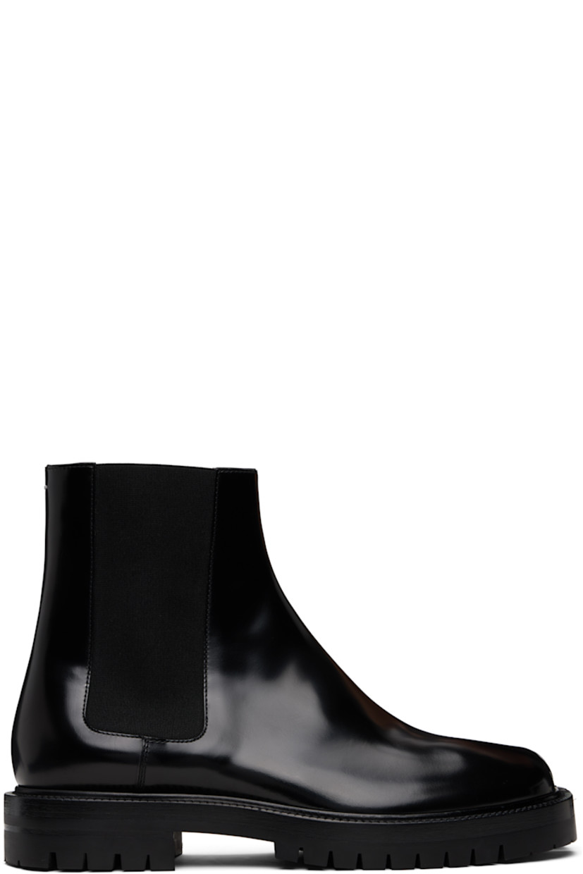 Ankle-high polished calfskin Chelsea boots.

· Square cleft toe
· Elasticized gusset at sides
· White stitching at heel collar
· Buffed lambskin lining
· Serrated edge at welt
· Treaded rubber sole

Supplier color: Black