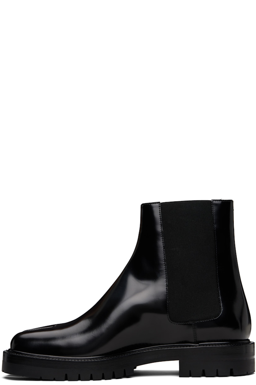 Ankle-high polished calfskin Chelsea boots.

· Square cleft toe
· Elasticized gusset at sides
· White stitching at heel collar
· Buffed lambskin lining
· Serrated edge at welt
· Treaded rubber sole

Supplier color: Black