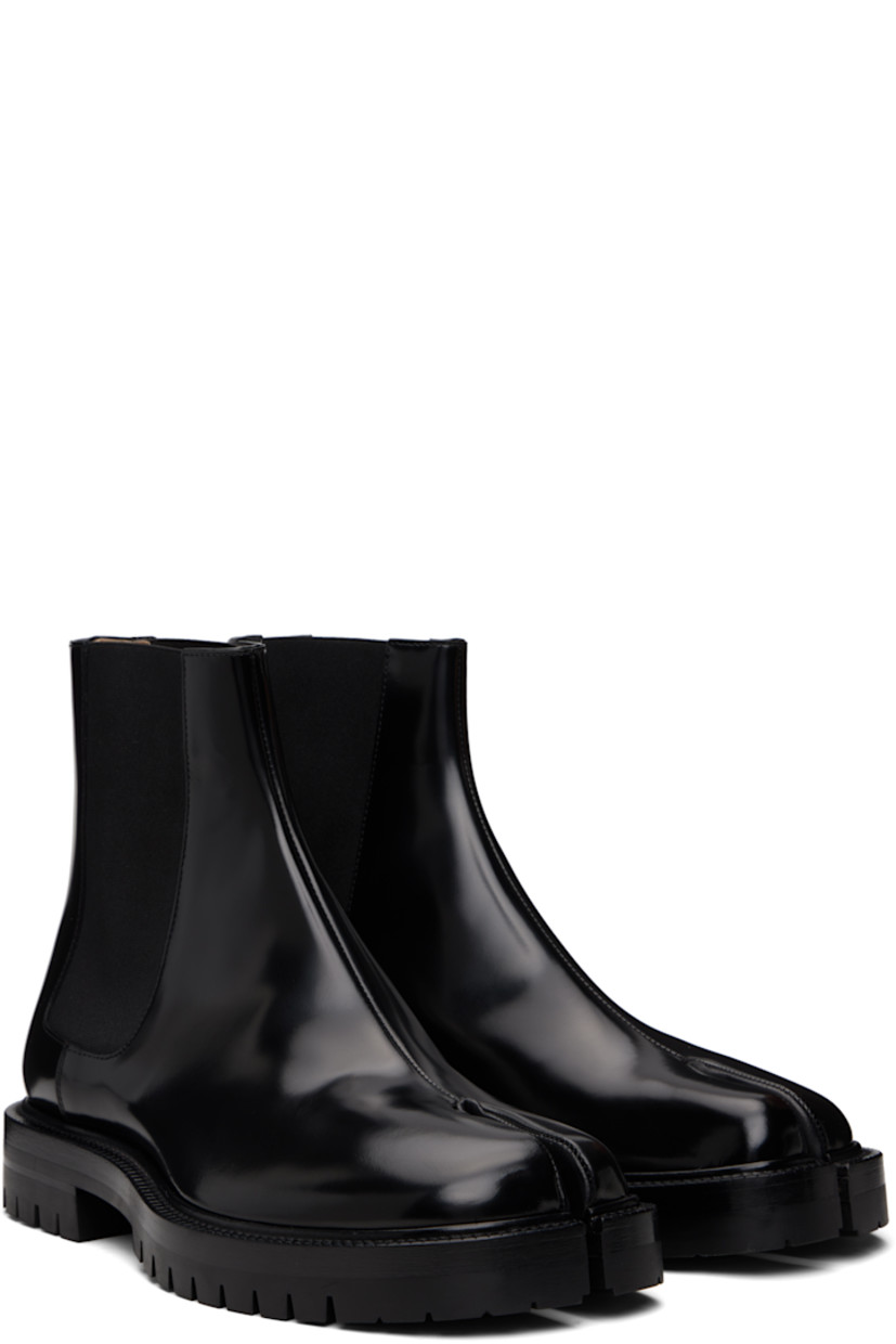 Ankle-high polished calfskin Chelsea boots.

· Square cleft toe
· Elasticized gusset at sides
· White stitching at heel collar
· Buffed lambskin lining
· Serrated edge at welt
· Treaded rubber sole

Supplier color: Black