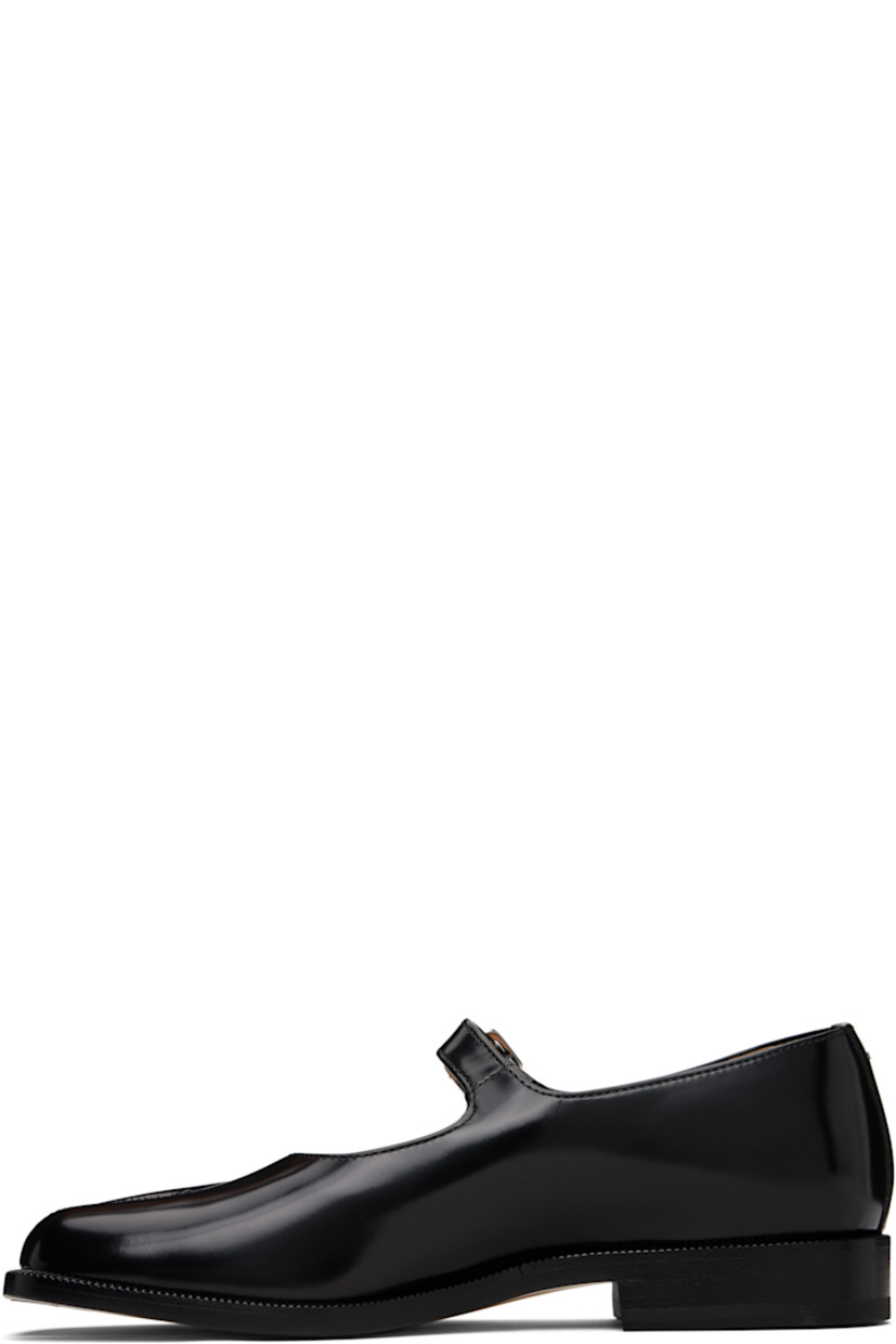 Polished calfskin Mary Jane-style loafers.

· Square cleft toe
· Pin-buckle strap at vamp
· White stitching at heel collar
· Buffed sheepskin lining
· Serrated edge at welt
· Stacked leather heel with rubber injection
· Calfskin sole

Supplier color: Black