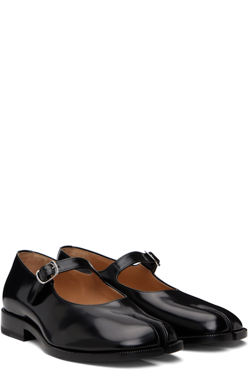 Polished calfskin Mary Jane-style loafers.

· Square cleft toe
· Pin-buckle strap at vamp
· White stitching at heel collar
· Buffed sheepskin lining
· Serrated edge at welt
· Stacked leather heel with rubber injection
· Calfskin sole

Supplier color: Black