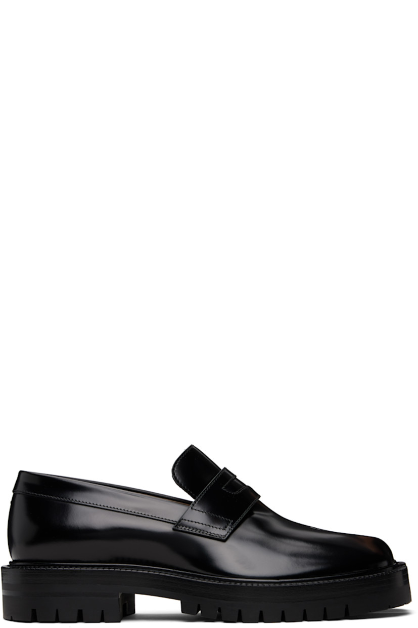 Polished calfskin loafers.

· Square cleft toe
· Strap with cutout at vamp
· White stitching at heel collar
· Buffed lambskin lining
· Serrated edge at welt
· Treaded rubber sole

Supplier color: Black