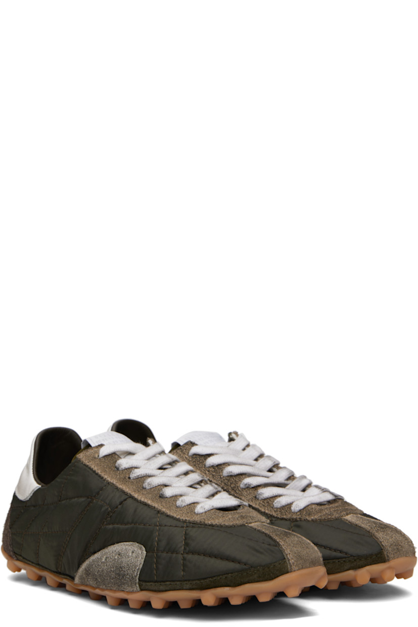 Low-top quilted taffeta and calfskin suede sneakers.

· Lace-up closure
· Logo patch at tongue
· White stitching at heel tab
· Twill lining
· Treaded rubber sole
 
Supplier color: Dark green/White