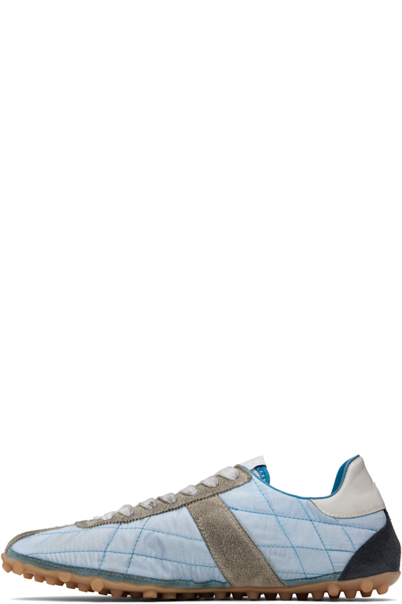 Low-top quilted taffeta and calfskin suede sneakers.

· Lace-up closure
· Logo patch at tongue
· White stitching at heel tab
· Twill lining
· Treaded rubber sole
 
Supplier color: Blue/White