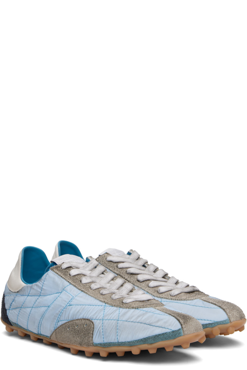 Low-top quilted taffeta and calfskin suede sneakers.

· Lace-up closure
· Logo patch at tongue
· White stitching at heel tab
· Twill lining
· Treaded rubber sole
 
Supplier color: Blue/White