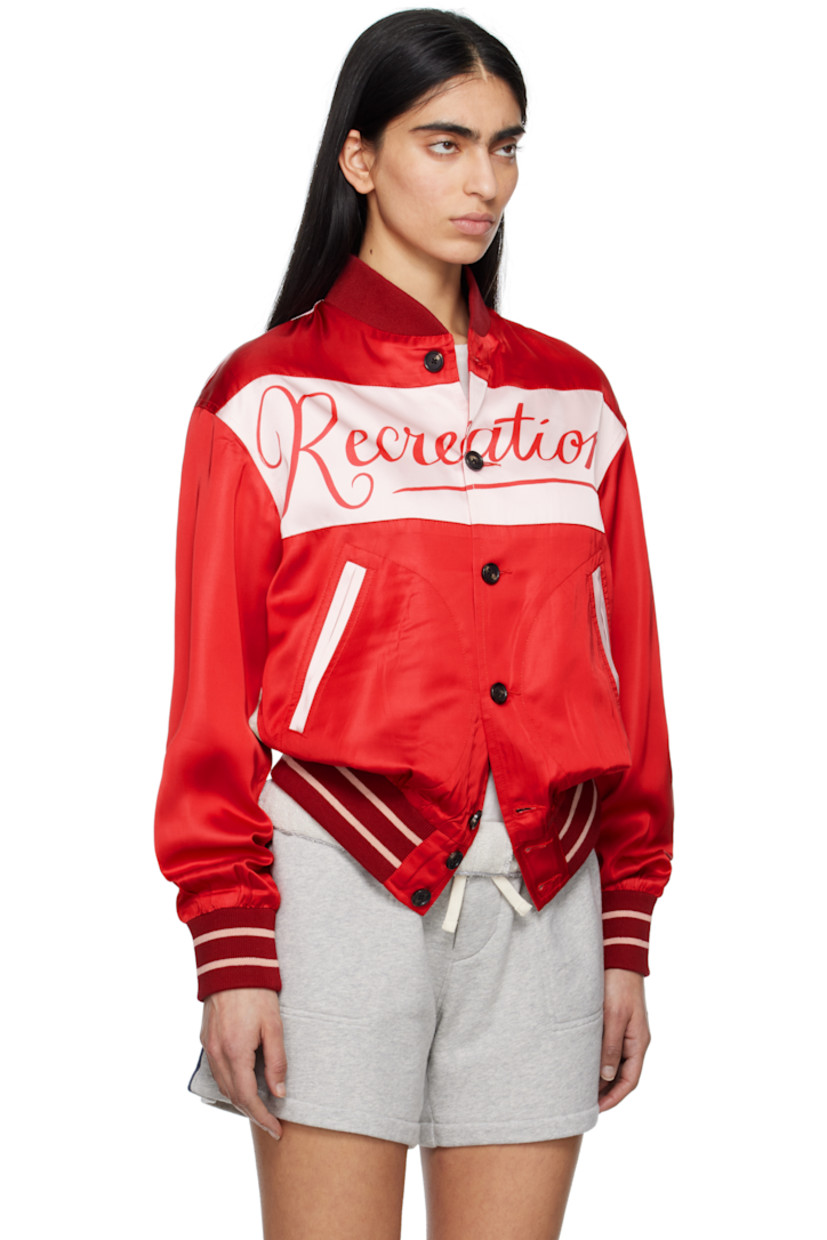 Viscose- and modal-blend satin jacket. 

· Rib-knit stand collar, hem, and cuffs
· Button closure
· Hand-printed text at chest and back 
· Welt pockets
· Stripes at hem and cuffs
· Hand-printed graphic at back
· Full cotton poplin lining

This item is part of a limited run of 68.

Supplier color: Multi