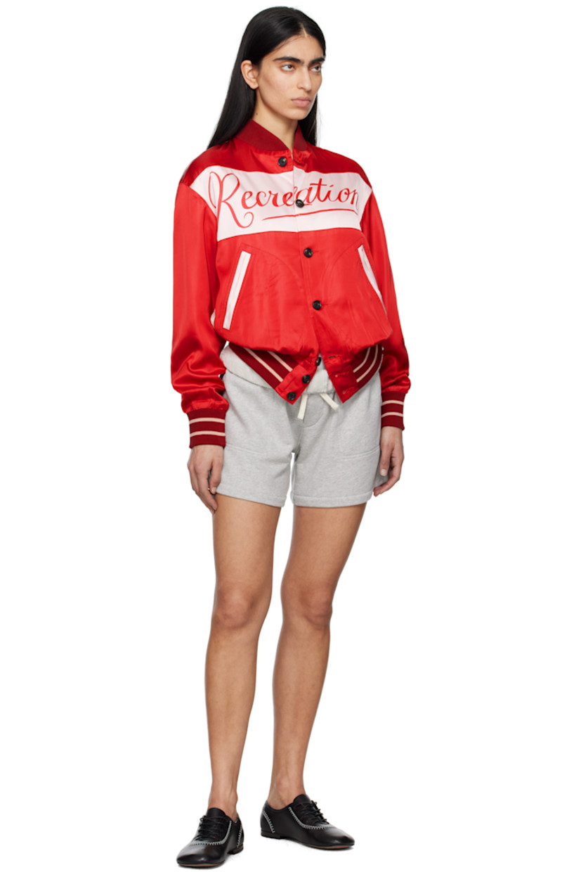 Viscose- and modal-blend satin jacket. 

· Rib-knit stand collar, hem, and cuffs
· Button closure
· Hand-printed text at chest and back 
· Welt pockets
· Stripes at hem and cuffs
· Hand-printed graphic at back
· Full cotton poplin lining

This item is part of a limited run of 68.

Supplier color: Multi