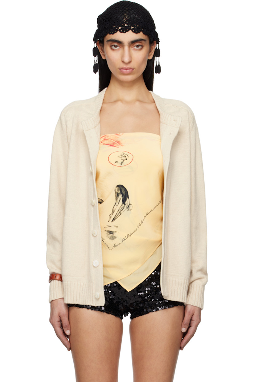 Knit pima cotton- and merino wool-blend cardigan. 

· Rib-knit crewneck, hem and cuffs
· Button closure
· Welt pockets
· Saddle shoulders 
· Logo embroidered at back
· Mother-of-pearl hardware

This item is part of a limited run of 51.

Supplier color: Ivory