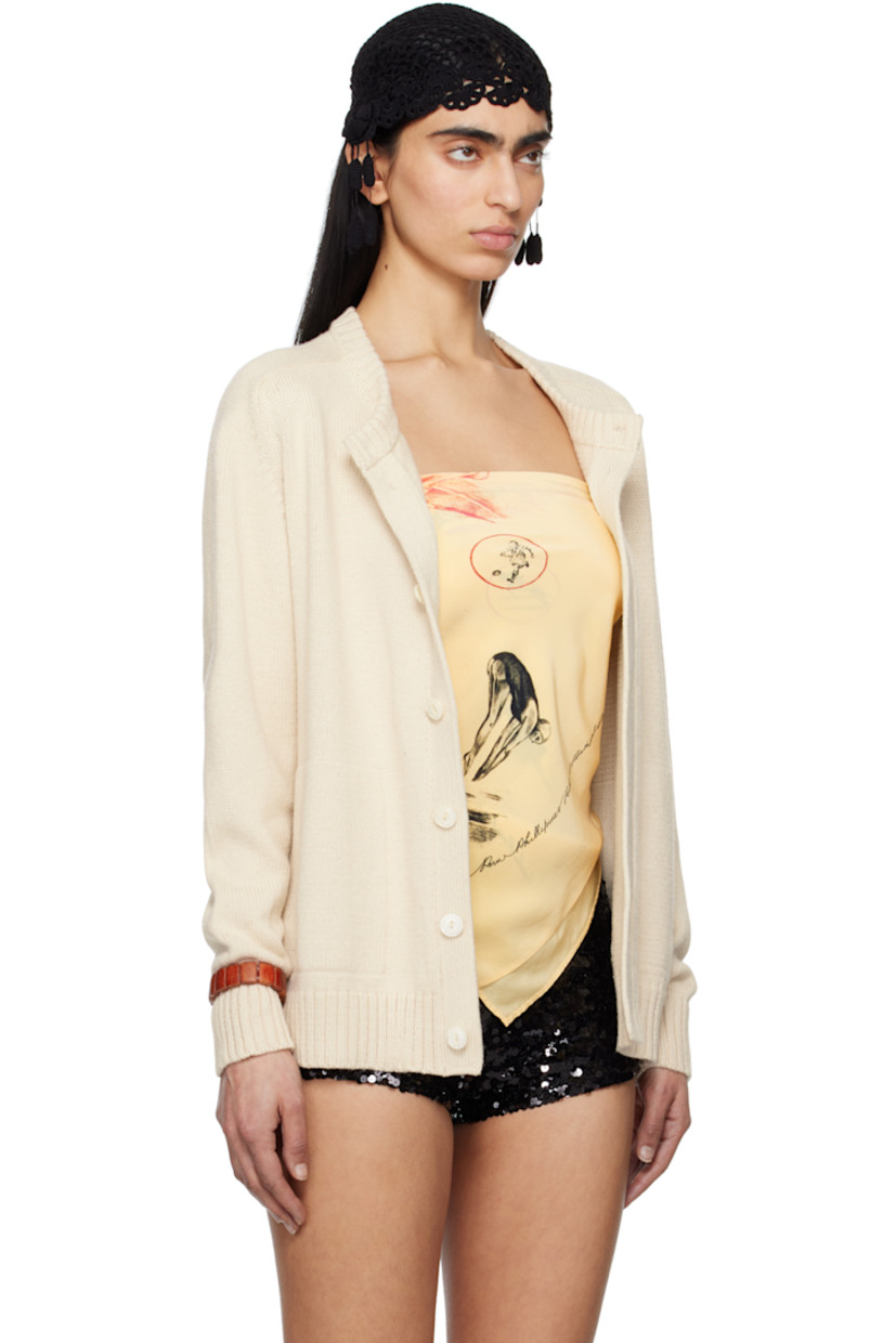 Knit pima cotton- and merino wool-blend cardigan. 

· Rib-knit crewneck, hem and cuffs
· Button closure
· Welt pockets
· Saddle shoulders 
· Logo embroidered at back
· Mother-of-pearl hardware

This item is part of a limited run of 51.

Supplier color: Ivory