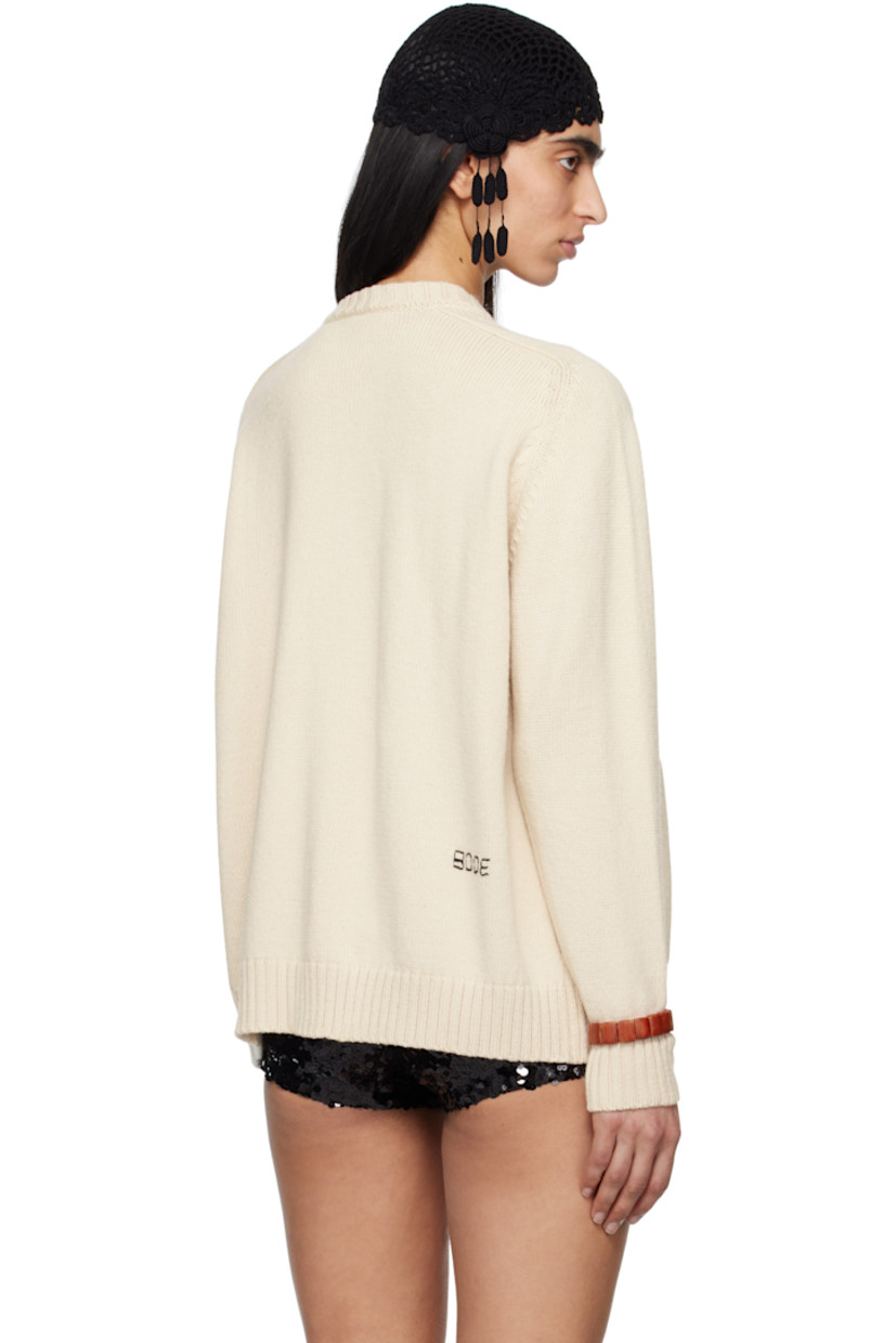 Knit pima cotton- and merino wool-blend cardigan. 

· Rib-knit crewneck, hem and cuffs
· Button closure
· Welt pockets
· Saddle shoulders 
· Logo embroidered at back
· Mother-of-pearl hardware

This item is part of a limited run of 51.

Supplier color: Ivory
