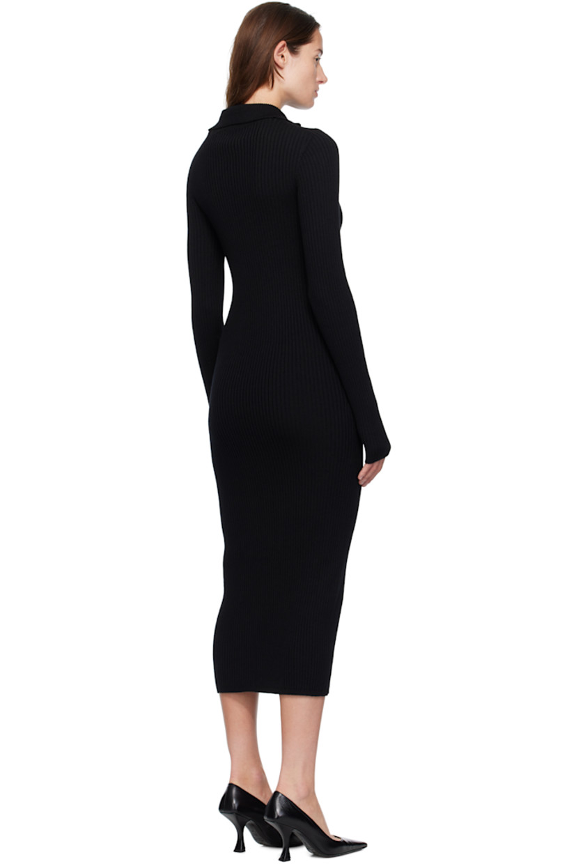 Rib-knit virgin wool maxi dress.

· Turtleneck
· Press-stud closure extends to collar
· Leather logo patch at sleeve
· Logo-engraved black hardware

Part of the Moncler Genius x EE72 by Edward Enninful collaboration.

Supplier color: Black