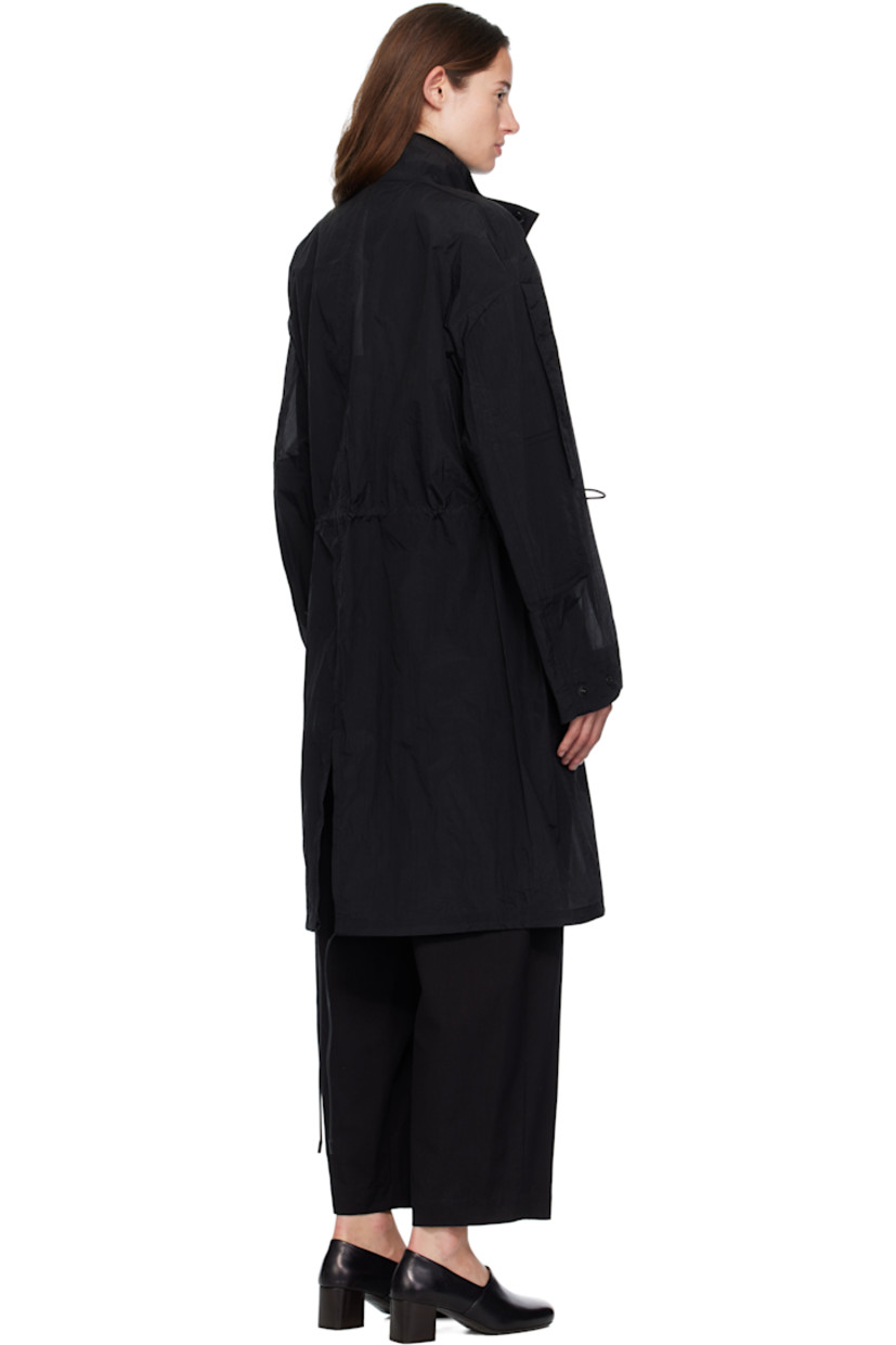 Nylon voile coat.

· Stand collar
· Press-stud closure
· Leather logo patch at chest
· Cord drawstring at waist and hem
· Press-stud flap pockets at front
· Extended trim at dropped shoulders
· Press-stud cuffs
· Central vent at back hem
· Unlined
· Logo-engraved black hardware

Part of the Moncler Genius x EE72 by Edward Enninful collaboration.

Supplier color: Black