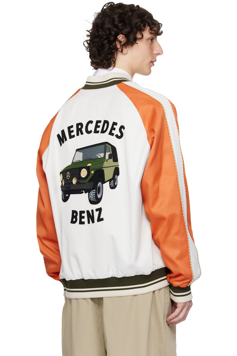 Reversible viscose- and cotton-blend twill jacket. 

Reverse in navy viscose- and cotton-blend twill. 

· Striped rib-knit stand collar, hem, and cuffs
· Zip closure
· Logo embroidered at chest
· Welt pockets
· Striped trim at raglan sleeves
· Logo and graphic embroidered at back 

Part of the Moncler Genius x Mercedes-Benz by NIGO collaboration.

Supplier color: Multicolor