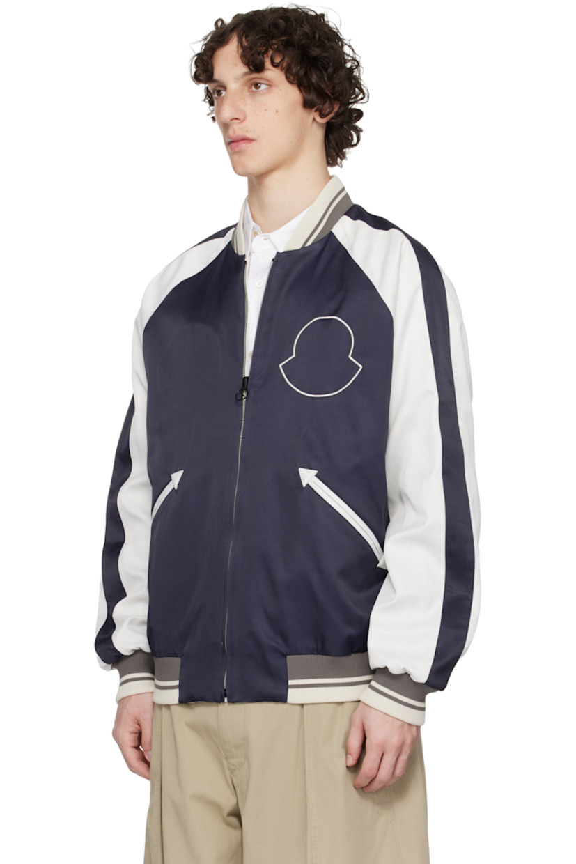 Reversible viscose- and cotton-blend twill jacket. 

Reverse in navy viscose- and cotton-blend twill. 

· Striped rib-knit stand collar, hem, and cuffs
· Zip closure
· Logo embroidered at chest
· Welt pockets
· Striped trim at raglan sleeves
· Logo and graphic embroidered at back 

Part of the Moncler Genius x Mercedes-Benz by NIGO collaboration.

Supplier color: Multicolor