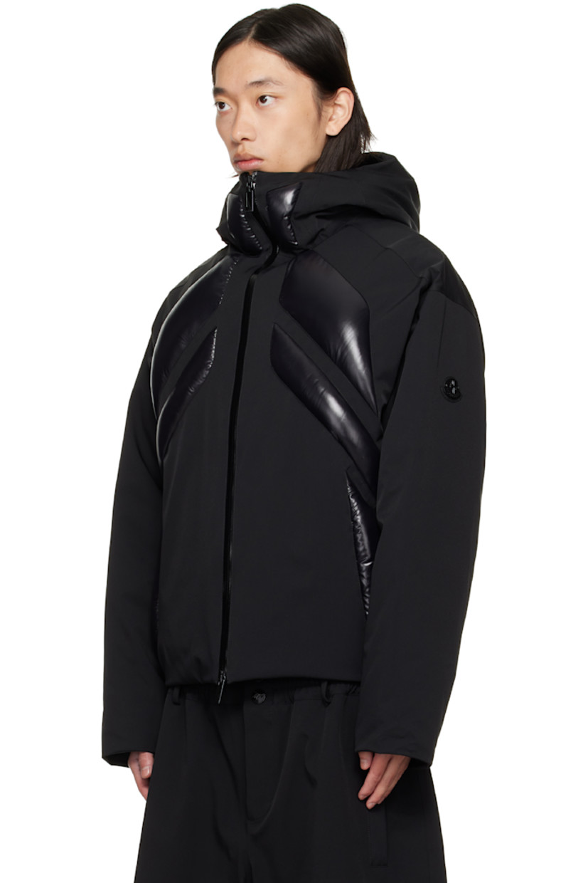 Down-filled stretch nylon taffeta jacket.

· DIST-certified down
· Hood at funnel neck
· Two-way zip closure
· Welt pockets at front
· Bungee-style drawstring at hem
· Logo patch at sleeve
· Logo printed at back hem
· Full quilted satin lining

Part of the Moncler Genius x AWGE by A$AP Rocky collaboration.

Supplier color: Black  

Fill: 90% goose down, 10% feather.