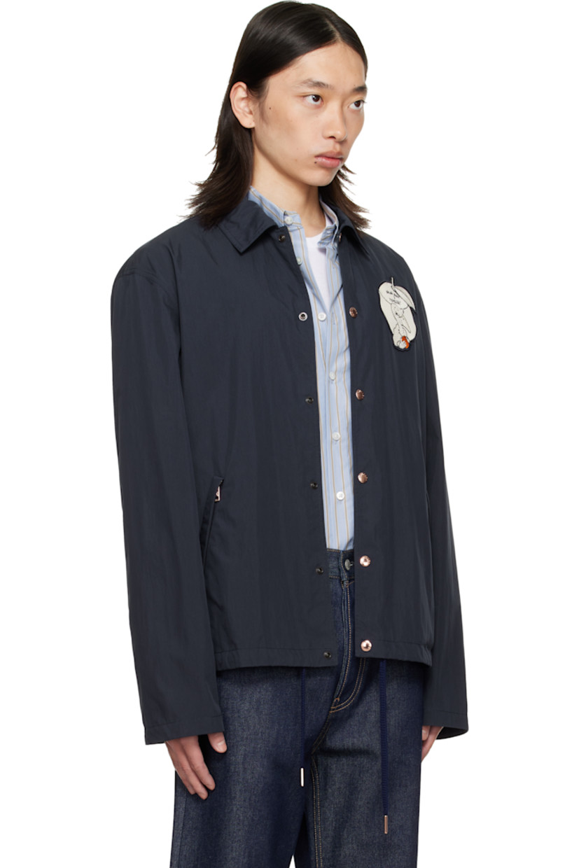 Crinkled cotton- and nylon-blend poplin jacket. 

· Spread collar
· Press-stud closure
· Embroidered graphic appliqué at chest and back
· Zip pockets at waist
· Embroidered logo patch at sleeve
· Press-stud cuffs
· Drawstring at hem
· Unlined

Part of the Moncler Genius x Gilga Farm by Donald Glover collaboration.

Supplier color: Starless Night
