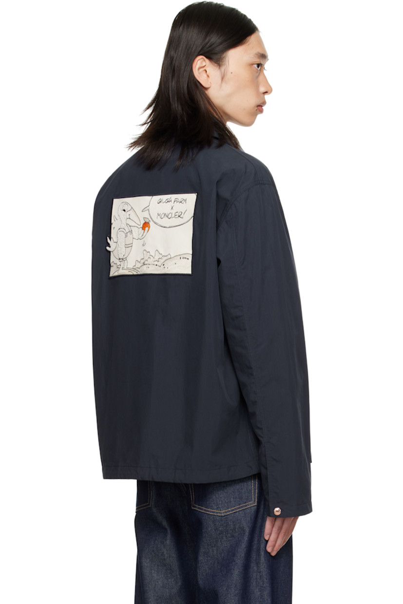 Crinkled cotton- and nylon-blend poplin jacket. 

· Spread collar
· Press-stud closure
· Embroidered graphic appliqué at chest and back
· Zip pockets at waist
· Embroidered logo patch at sleeve
· Press-stud cuffs
· Drawstring at hem
· Unlined

Part of the Moncler Genius x Gilga Farm by Donald Glover collaboration.

Supplier color: Starless Night