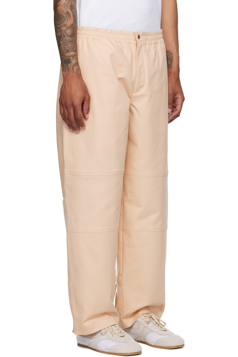 Stretch cotton- and nylon-blend twill trousers.

· Concealed drawstring at elasticized waistband
· Three-pocket styling
· Zip fly
· Drawstring at legs
· Embroidered logo graphic patch at back pocket

Part of the Moncler x Gilga Farm collaboration.

Supplier color: Gilga orange