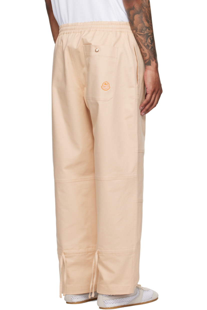 Stretch cotton- and nylon-blend twill trousers.

· Concealed drawstring at elasticized waistband
· Three-pocket styling
· Zip fly
· Drawstring at legs
· Embroidered logo graphic patch at back pocket

Part of the Moncler x Gilga Farm collaboration.

Supplier color: Gilga orange