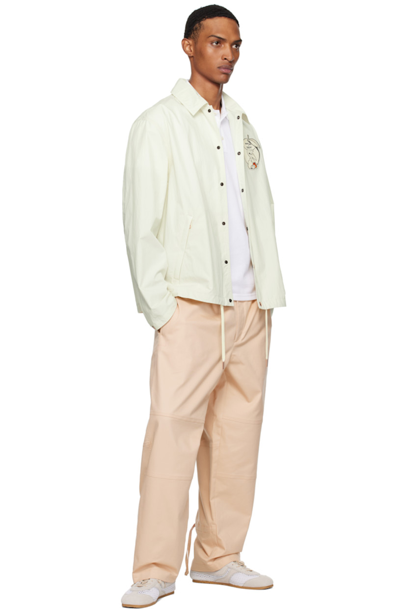 Stretch cotton- and nylon-blend twill trousers.

· Concealed drawstring at elasticized waistband
· Three-pocket styling
· Zip fly
· Drawstring at legs
· Embroidered logo graphic patch at back pocket

Part of the Moncler x Gilga Farm collaboration.

Supplier color: Gilga orange