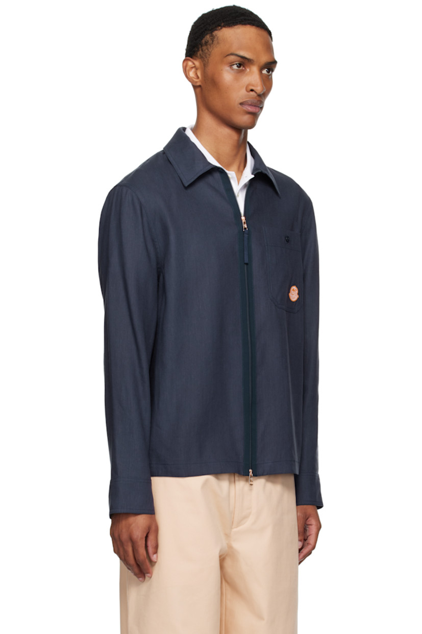Linen-blend hopsack shirt.

· Spread collar
· Two-way zip closure
· Patch pocket and logo graphic patch at chest
· Buttoned barrel cuffs

Part of the Moncler x Gilga Farm collaboration.

Supplier color: Starless night