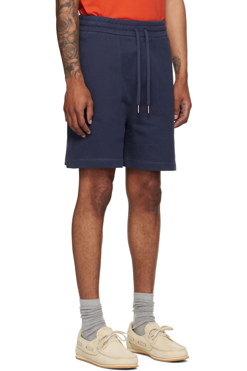 French terry shorts.

· Drawstring at elasticized waistband
· Three-pocket styling
· Embroidered logo patch at front

Part of the Moncler Genius x Gilga Farm collaboration.

Supplier color: Starless night