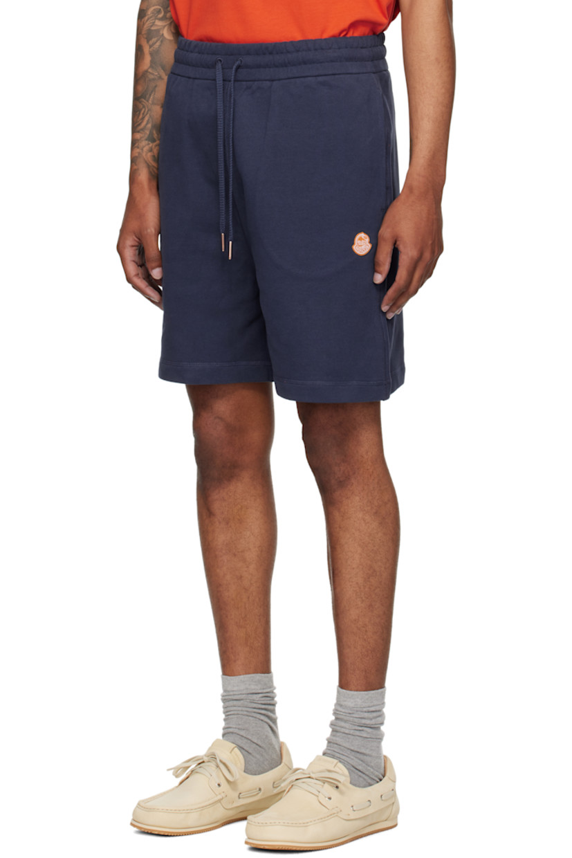 French terry shorts.

· Drawstring at elasticized waistband
· Three-pocket styling
· Embroidered logo patch at front

Part of the Moncler Genius x Gilga Farm collaboration.

Supplier color: Starless night