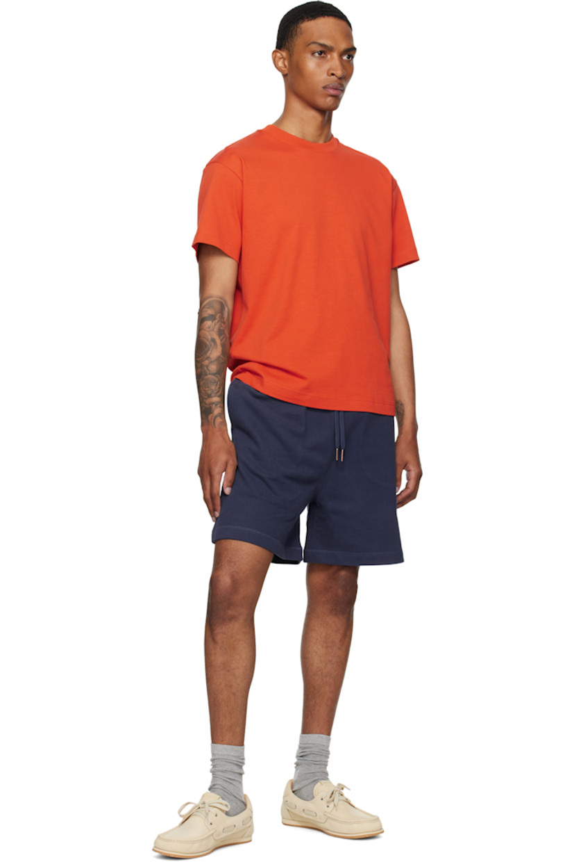 Cotton jersey T-shirt.

· Rib-knit crewneck
· Embroidered logo patch at sleeve
· Logo graphic printed at back

Part of the Moncler Genius x Gilga Farm collaboration.

Supplier color: Orange rust