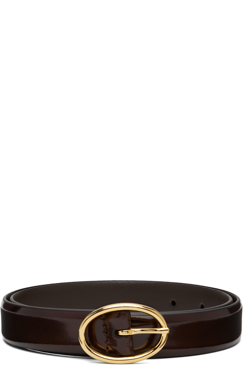 Handcrafted patent calfskin belt.

· Pin-buckle fastening 
· Gold-tone hardware 
· W1"

Supplier color: Dark brown