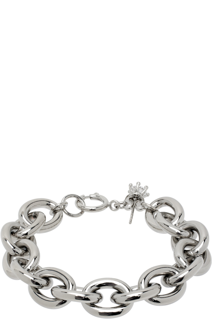 Cable chain bracelet in silver-tone brass.

· Prong-set cubic zirconia charm at length
· Spring-ring fastening 
· L7"

Supplier color: Silver