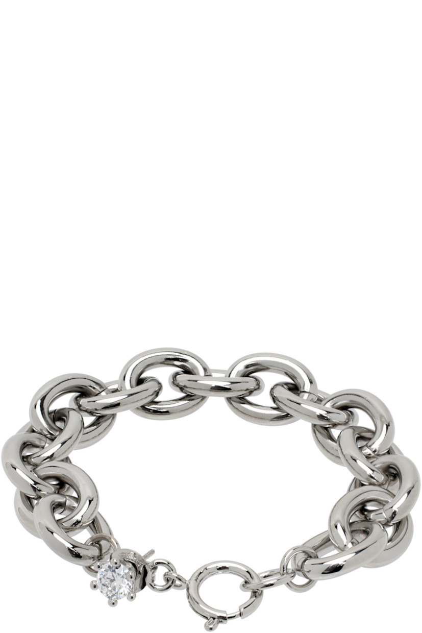 Cable chain bracelet in silver-tone brass.

· Prong-set cubic zirconia charm at length
· Spring-ring fastening 
· L7"

Supplier color: Silver