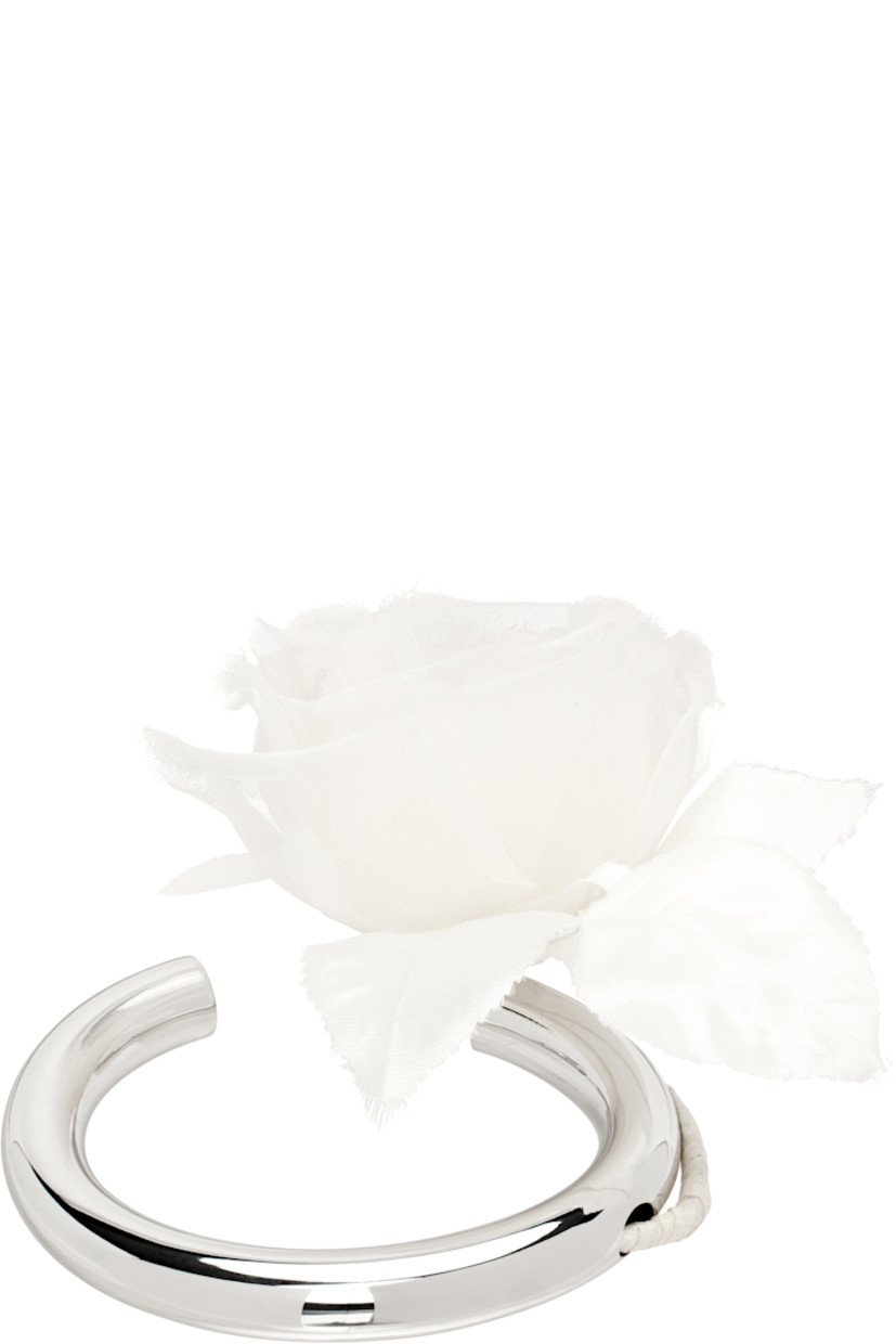 Open cuff bracelet in silver-tone brass.

· Floral accent at end
· D2.75"

Part of the exclusive SSENSE Bridal capsule.

Supplier color: Silver/Yellow